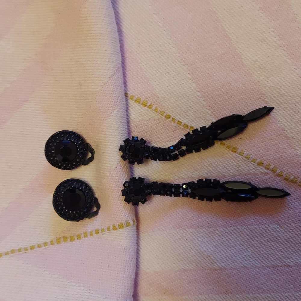 TWO pairs of CLIP ON black earrings